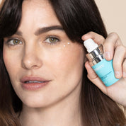 Woman holding Lumiere Firm Eye product