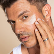 Woman wearing the Hyaluronic Acid Microneedle Eye Patches by PCA Skin