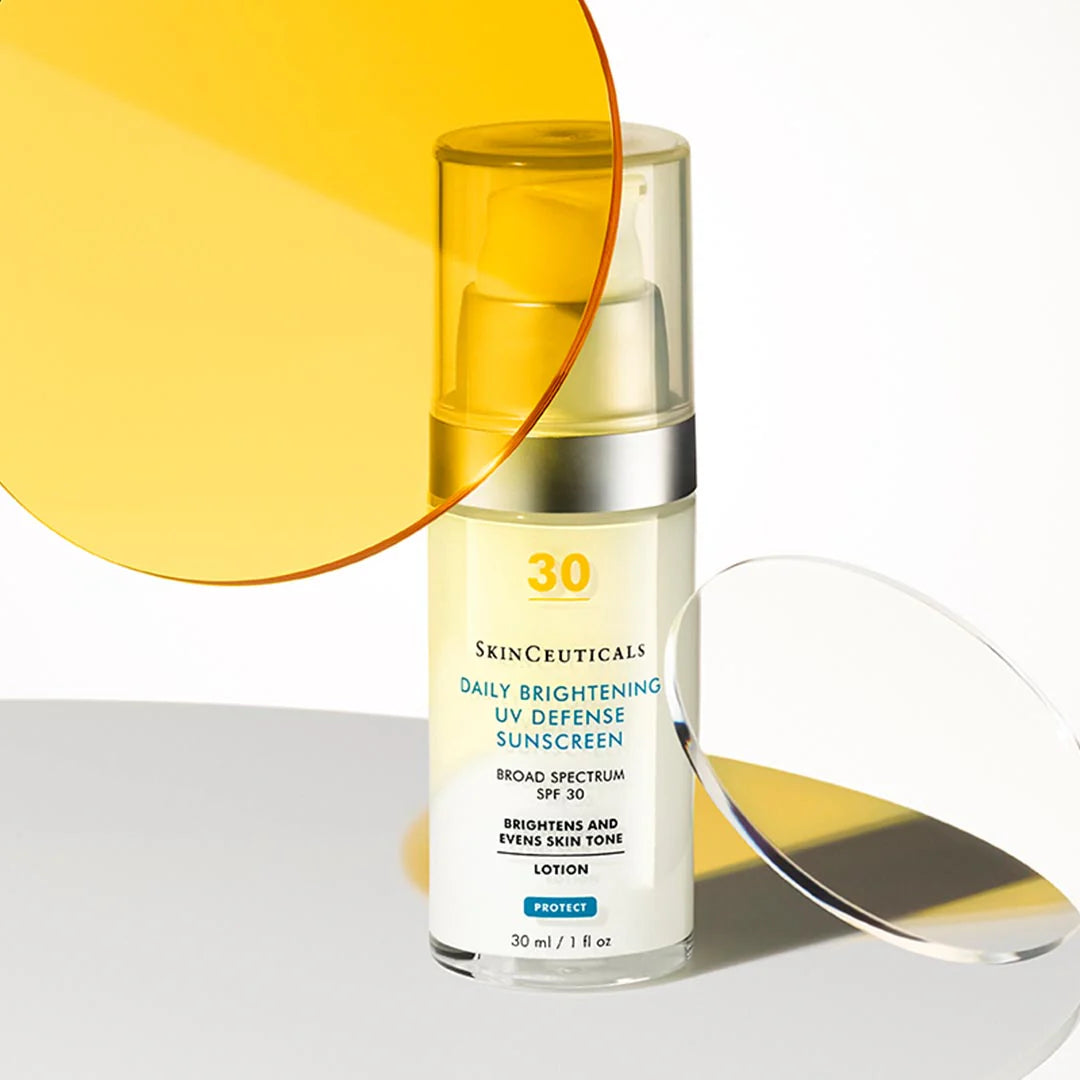 SkinCeuticals Daily Brightening UV Defense Sunscreen bottle with yellow and orange gradient background