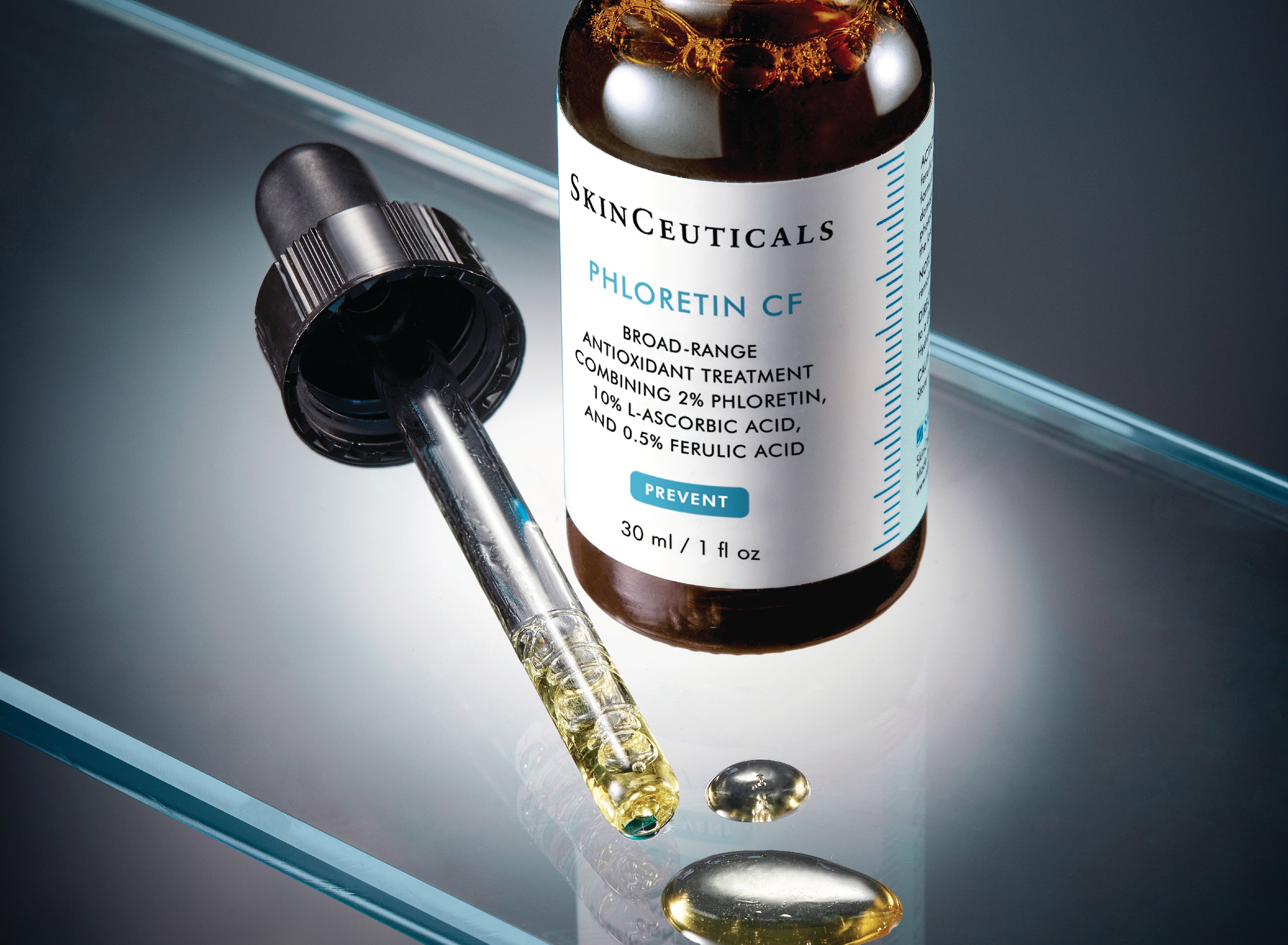 Skinceuticals Phloretin CF on glass with a dropper next to it