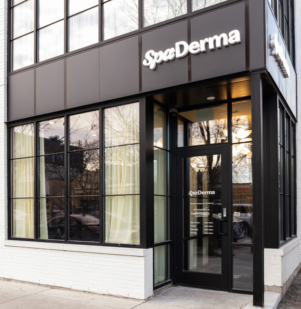 SpaDerma store front with large glass windows and a visible sign.